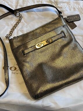 Coach Swagger Swingpack Metallic Gold Crossbody Bag with Turnlock Detail and bag